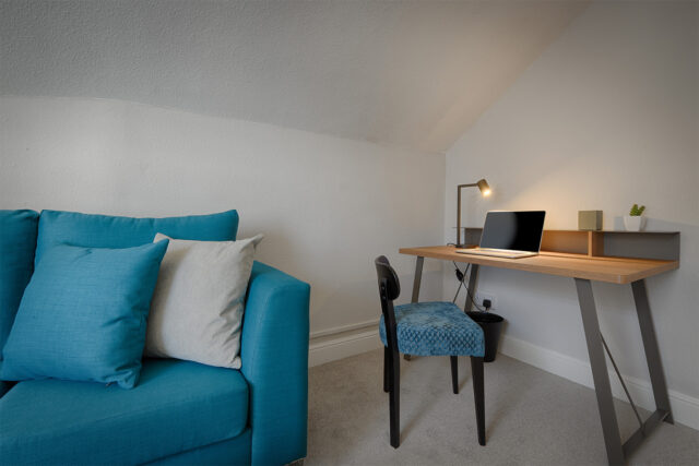 Counselling room with sofa and desk